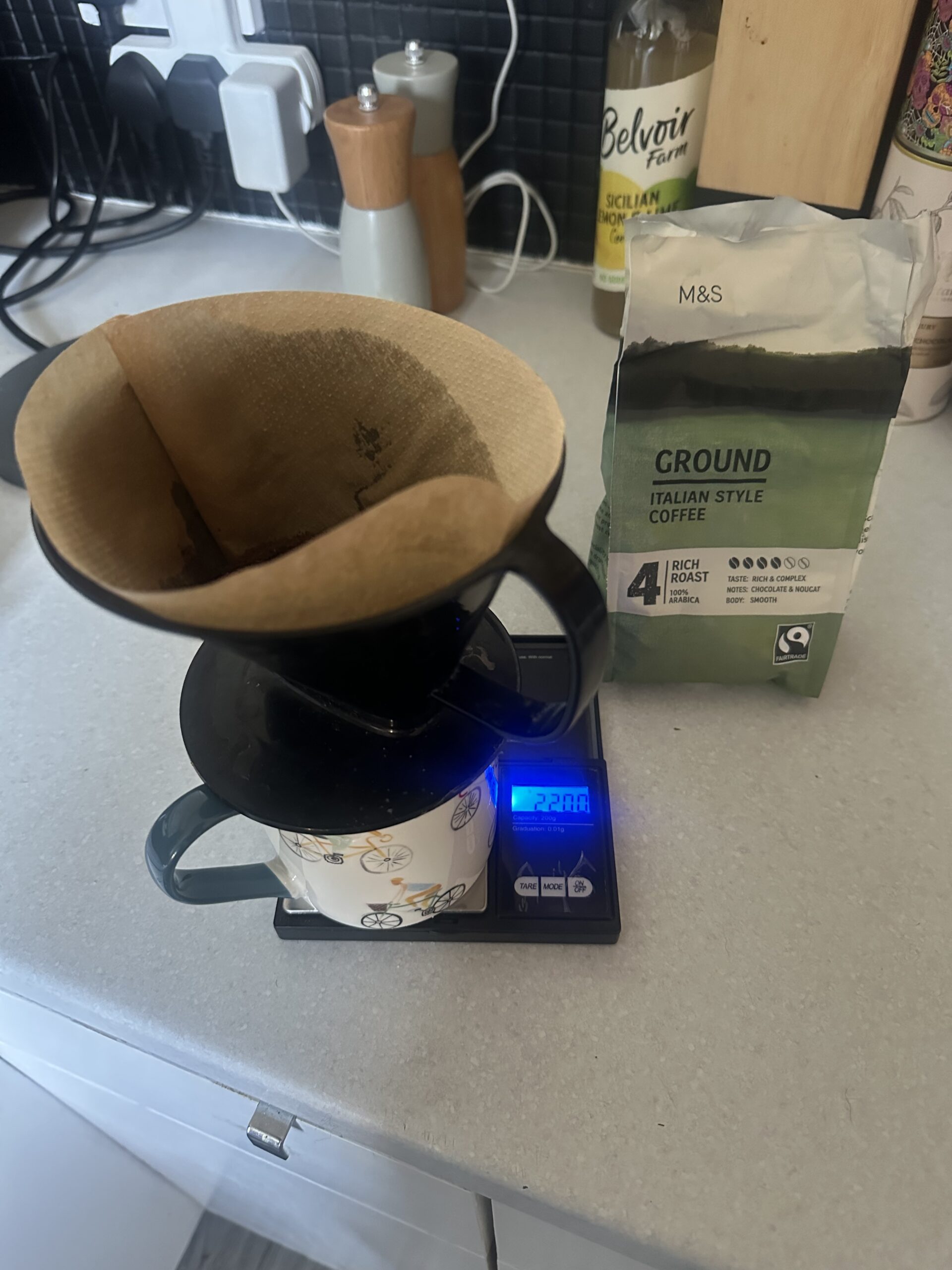 Image of a V60 coffee brewer on a two decimal place scale