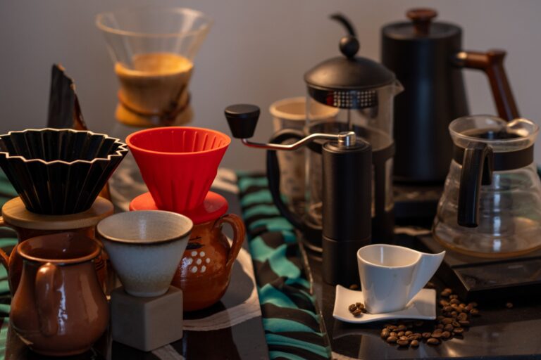 Explore an array of coffee brewing tools including drippers, grinders, and cups, ideal for crafting specialty coffee at home.